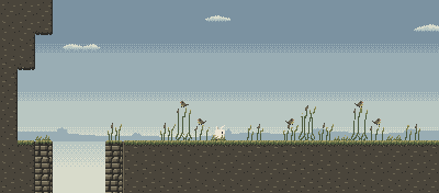 Reedfen: tall reeds with small birds perched on them, under a wide grey-blue sky.
